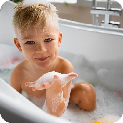 medium shot boy playing bathtub