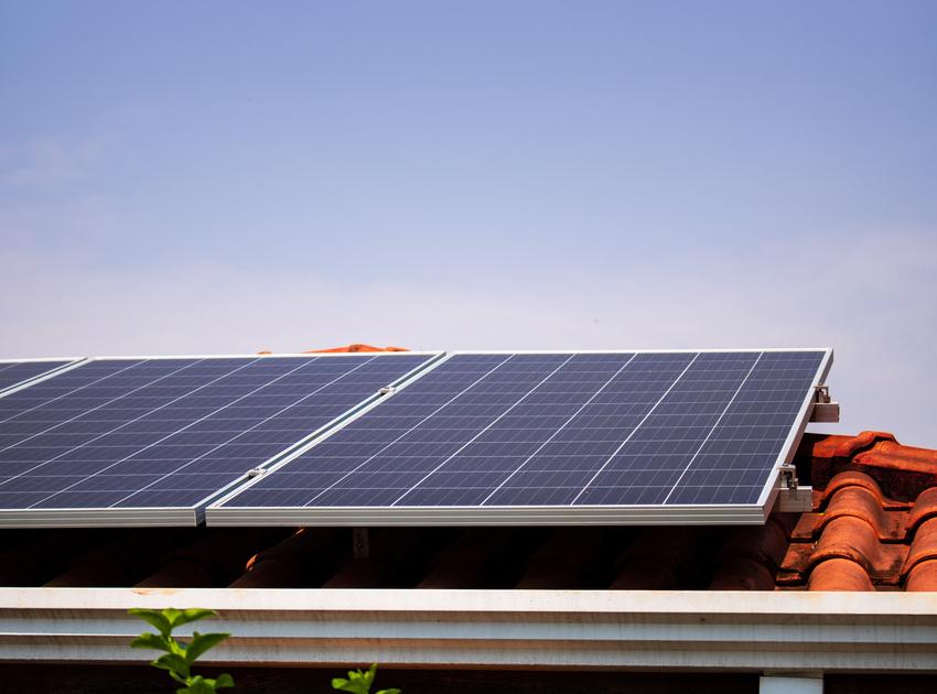 People holding solar panel